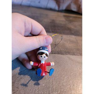 Sitting girl red‎ dress blue hat ornament xmas